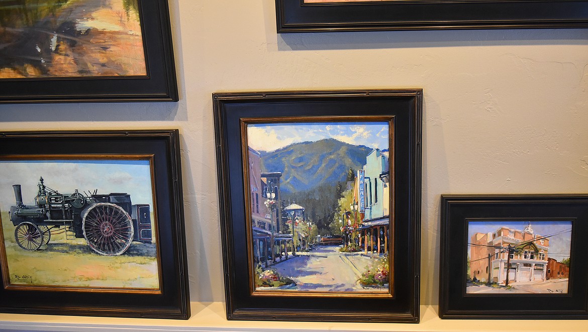 Finished paintings line the walls in Rob Akey’s art studio. His artist renderings of Central Avenue in downtown Whitefish are one of his works that seem to resonate with people, he notes. (Heidi Desch/Whitefish Pilot)
