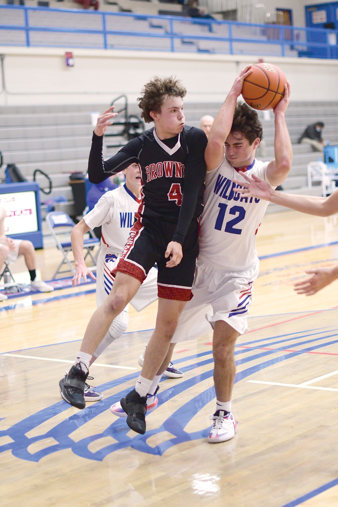 Mason Peters collides with a Browing player during Saturday's game. (Teresa Byrd/Hungry Horse News)