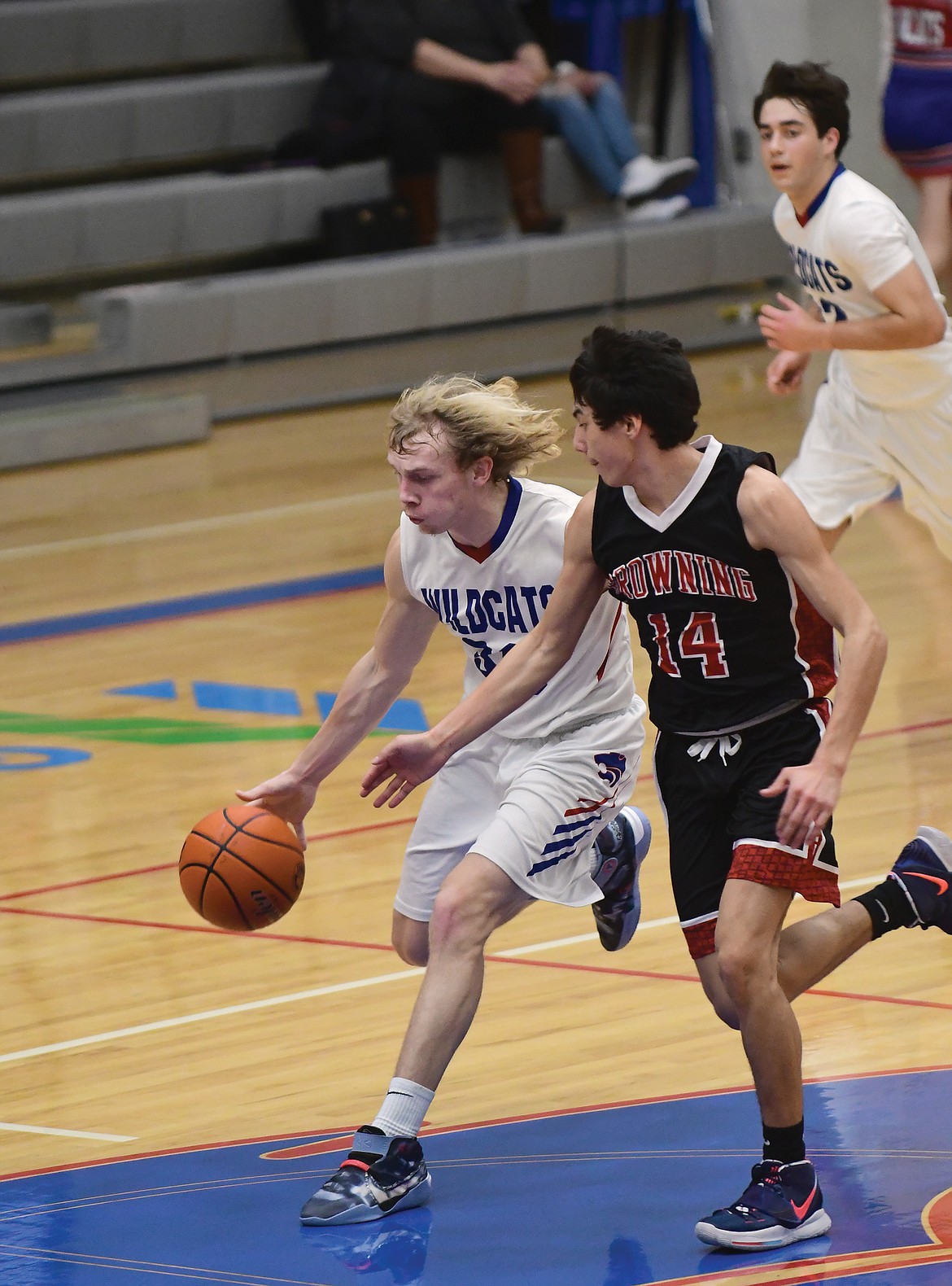 Allec Knapton speeds past a Browning player during Saturday's game. (Teresa Byrd/Hungry Horse News)