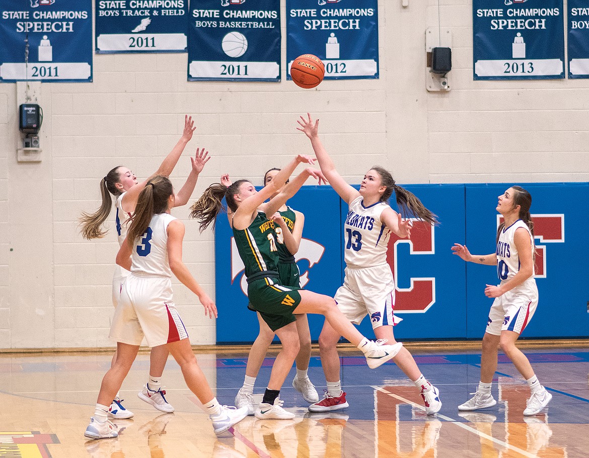 Grace Gedlaman deflects a Bulldog pass as the Wildkats converge on the Bulldogs.  From left is Lauren Falkner, Middie Robison, Gedlaman and Alexis Green. (Chris Peterson photo)