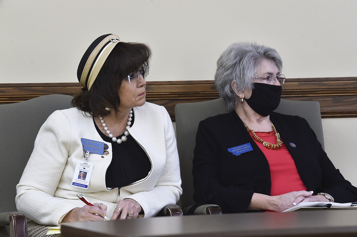 State Reps. Lola Sheldon-Galloway, R-Great Falls, left, and Sharon Greef, R-Florence, listen to testimony in the House Judiciary Committee at the State Capitol, Tuesday, Jan. 19, 2021, in Helena, Mont. (Thom Bridge/Independent Record via AP)