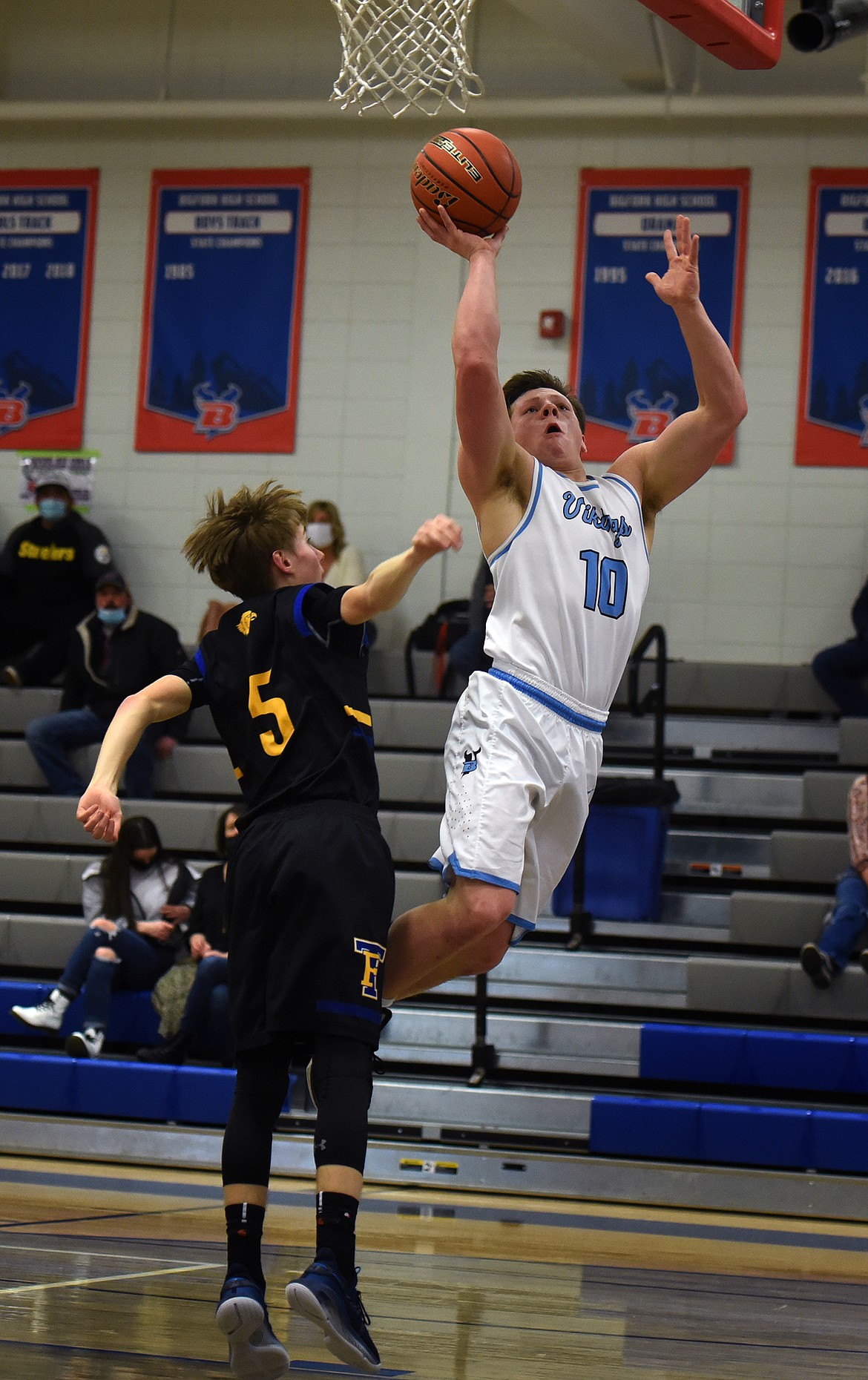 Levi Taylor soars past Thompson Falls defender Justin Morgan for two of his six points Tuesday.
Jeremy Weber