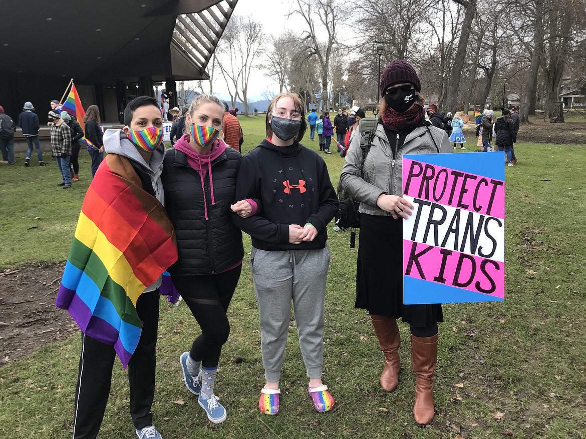 From left, Angie Rios, Andrea Newsom, Koda Martin and Alix Taylor she their support with an intersectional LGBTQ+ flag and rainbow masks.