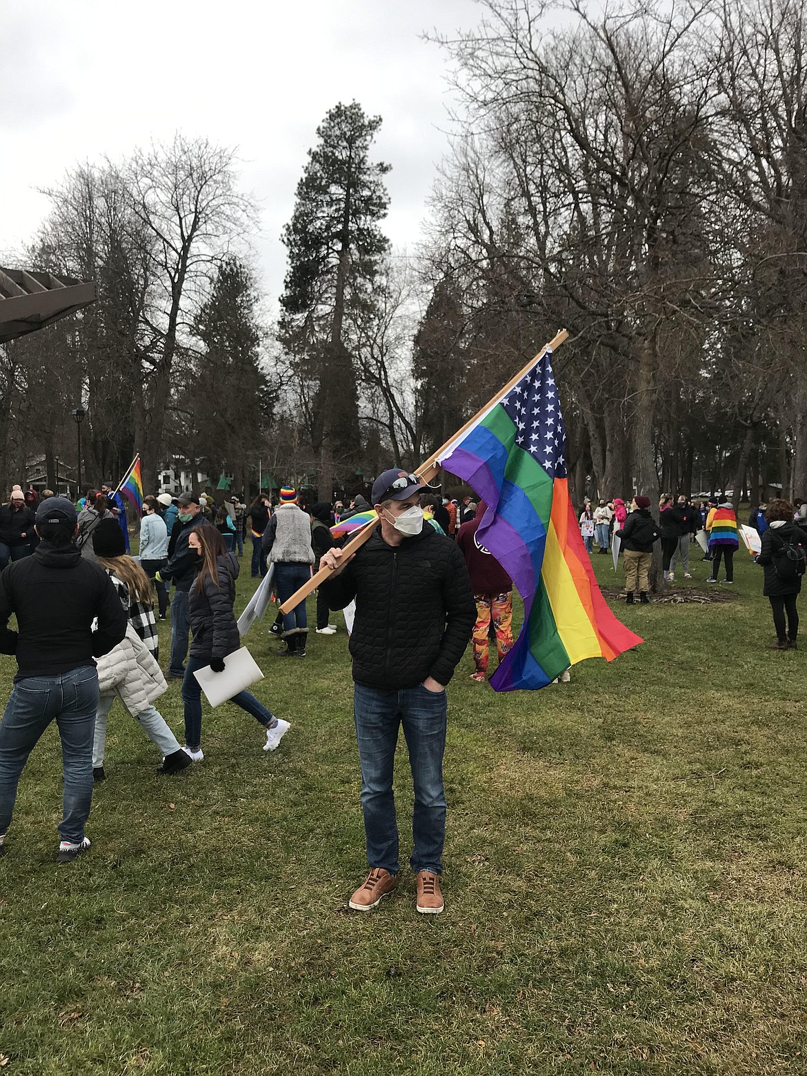 Michael Schmidt holding U.S. Pride Flag in support of LGBTQ+ Youth