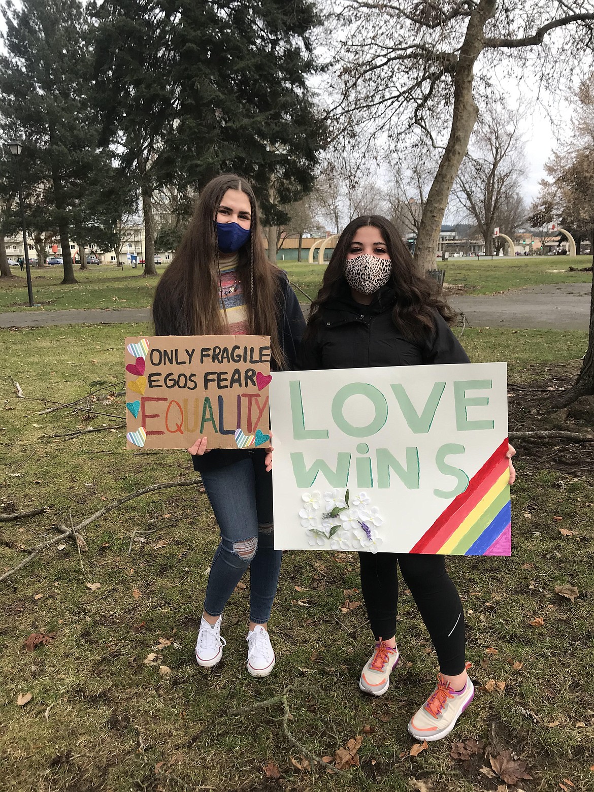 Abby Fitzgerald (left) and Izabella Swanson remind their community that equality and love wins.