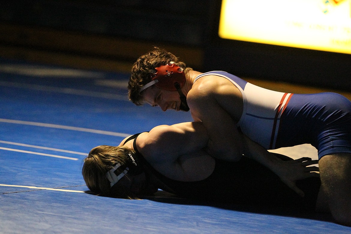 JASON ELLIOTT/Press
Coeur d'Alene High wrestler Nolan Randles keeps Sandpoint's Trevan Adam on the mat during their bout at 152-pounds at Coeur d'Alene High on Wednesday. Randles pinned Adam in 2 minutes, 31 seconds in the Vikings' 75-12 dual win.