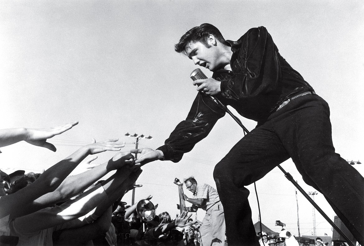 Because of his music and singing style, Elvis became a cultural icon in the 1950s, shown here performing at the Mississippi-Alabama Fairgrounds in Tupelo, Miss. (1956).