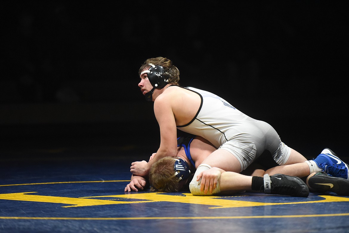 Libby senior Tucker Masters pins Wildcat Lucas Thacker in the 170 pound category. (Will Langhorne/The Western News)