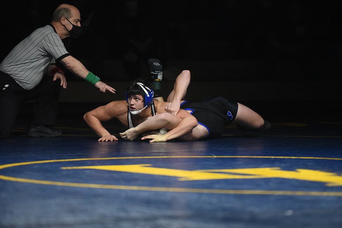 Libby Freshman Jace DeShazer pins Wildcat Rowdy White in the 160 pound category. (Will Langhorne/The Western News)