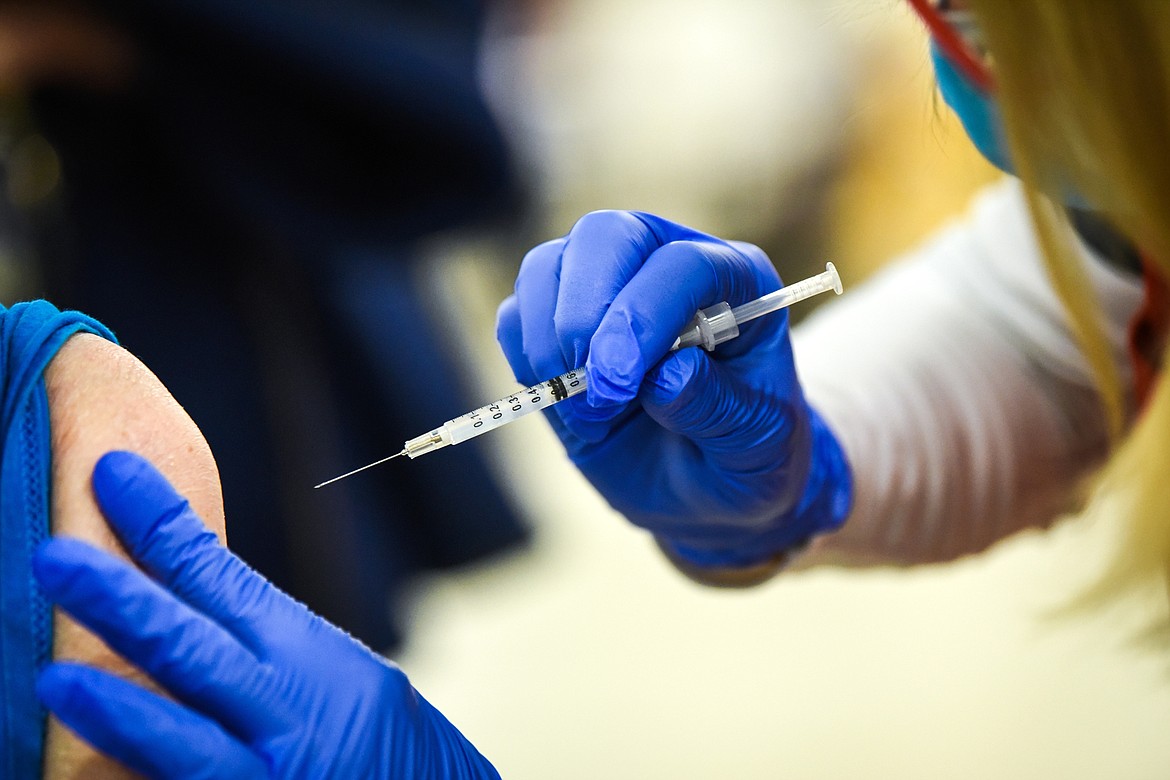 This Jan. 21, 2021, file photo shows a Covid-19 vaccine being administered during a clinic at the Flathead County Fairgrounds. (Casey Kreider/Daily Inter Lake)