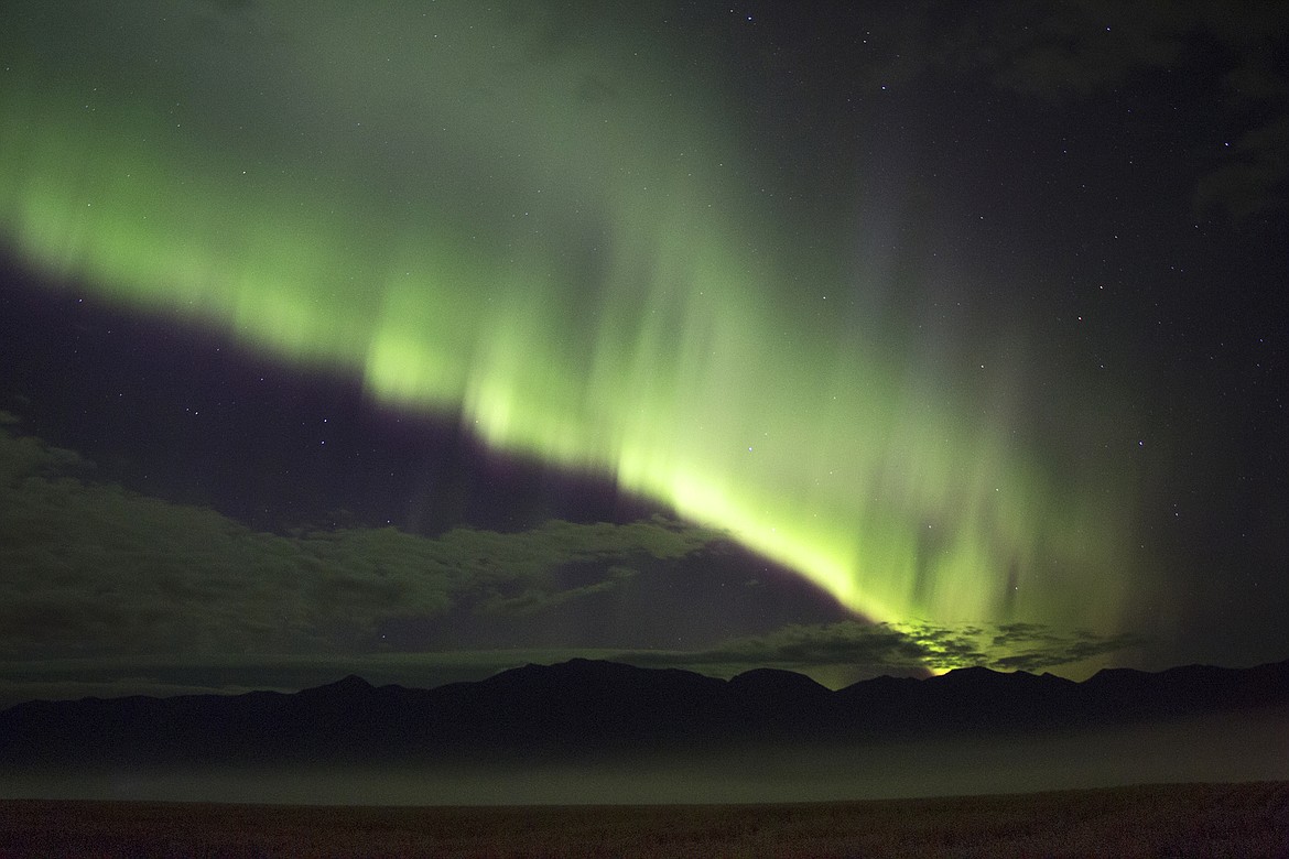 The aurora lights up the sky east of Bigfork. (Photo by Cassie Lasson and Drew Carter)