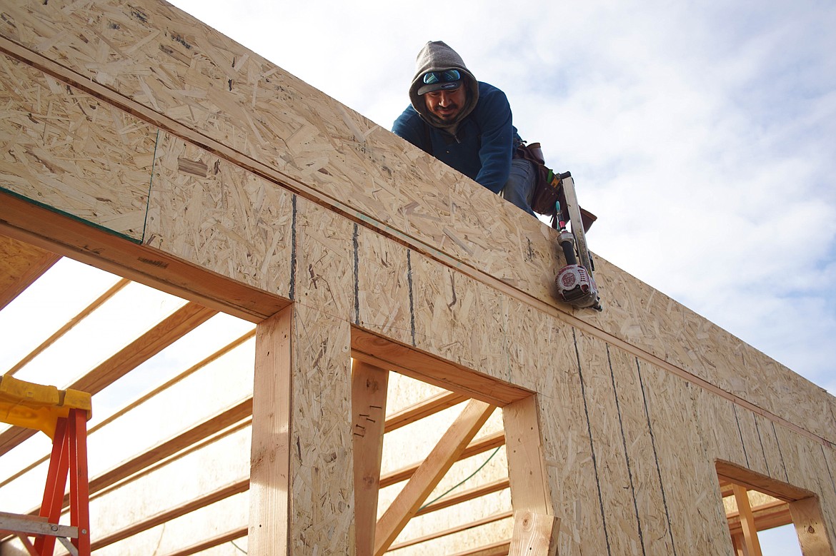 Ramiro Espino builds the frame of Paradise Park homesite #03 on L Street.