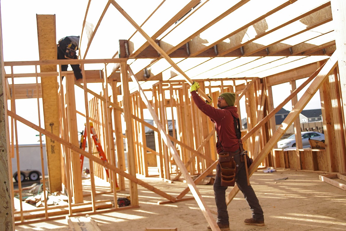 Miguel Charles builds the frame of Paradise Park homesite #03 on L Street.