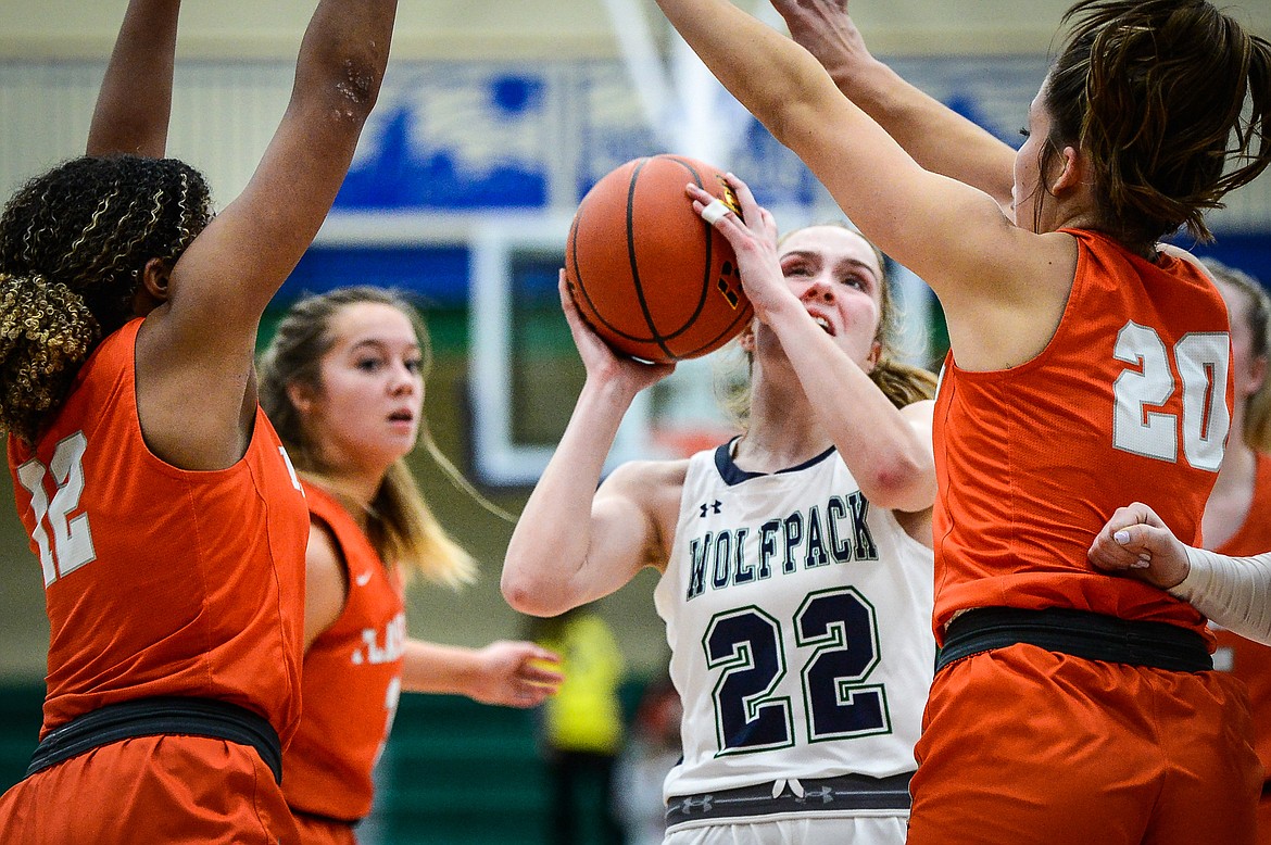 Glacier's Ellie Keller (22) drives to the basket against Flathead in the first half at Glacier High School on Friday. (Casey Kreider/Daily Inter Lake)