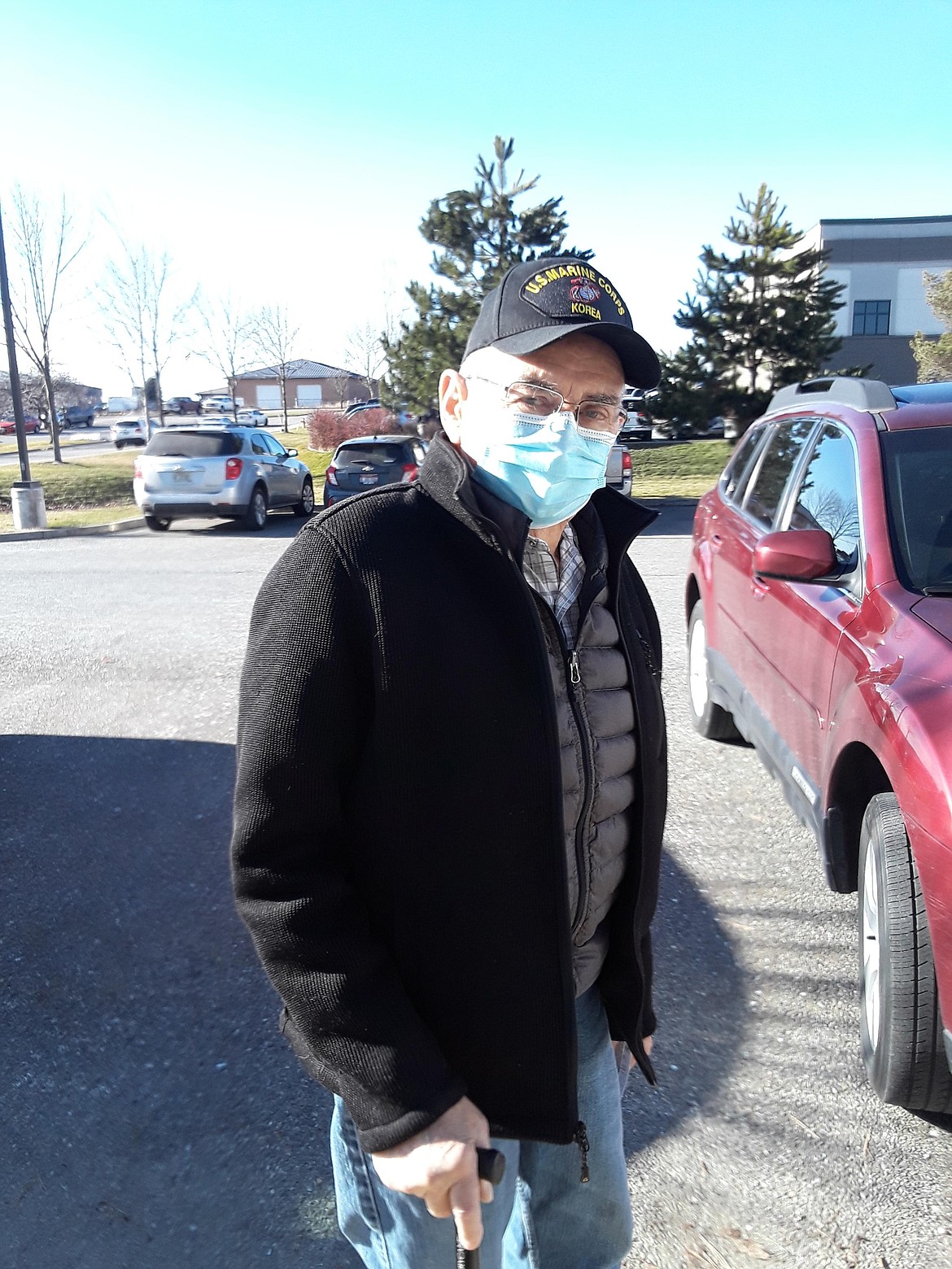 A masked Marvin Satuloff of Coeur d'Alene celebrated Friday with a smile (we think) after receiving the first dose of his COVID-19 vaccine. The local health district is asking for patience as distribution delays have cut Panhandle Health's weekly vaccine quantity down to roughly 2,800 doses per week. "It’s going to take us and our partners a while to get through this group," said Katherine Hoyer, public information officer for Panhandle Health. "That’s just the way that it is. We’re going to have to do this together.”