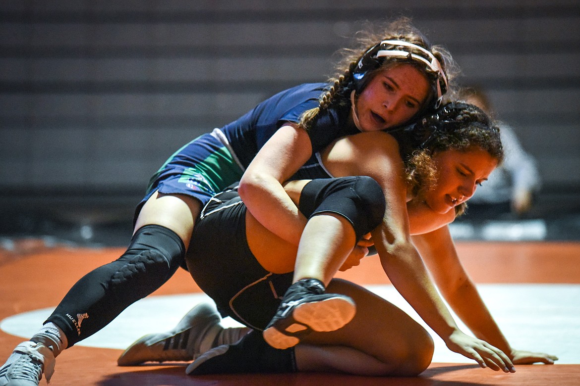 Glacier's Nora Halliday wrestles Flathead's Isabelle Brewer at 132 lbs. at Flathead High School on Friday. (Casey Kreider/Daily Inter Lake)