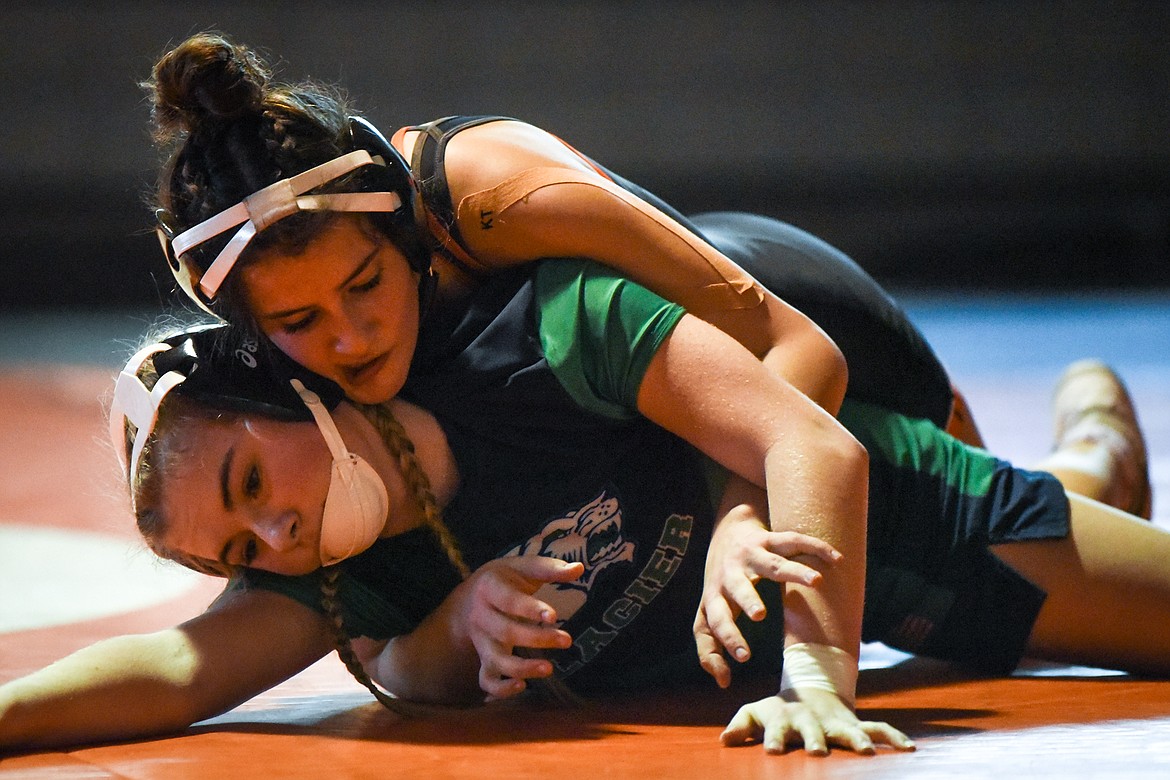 Flathead's Bella Arriaga wrestles Glacier's Emily Pedron at 126 lbs. at Flathead High School on Friday. (Casey Kreider/Daily Inter Lake)