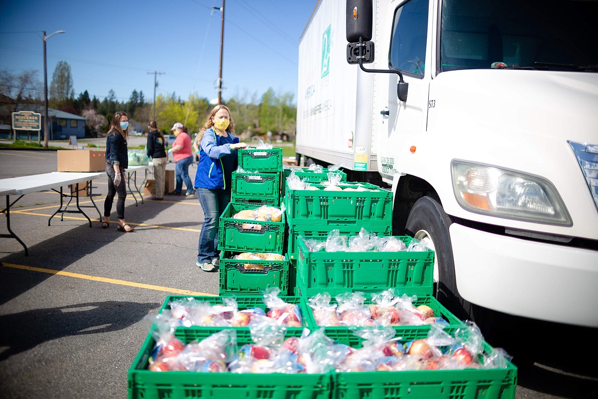 Volunteers from Christ Our Redeemer Lutheran Church help out at a recent food distribution event. Christ Our Redeemer Lutheran Church in Sandpoint is partnering with 2nd Harvest of Spokane to bring a fourth emergency food distribution to the area on Friday, Jan. 29.