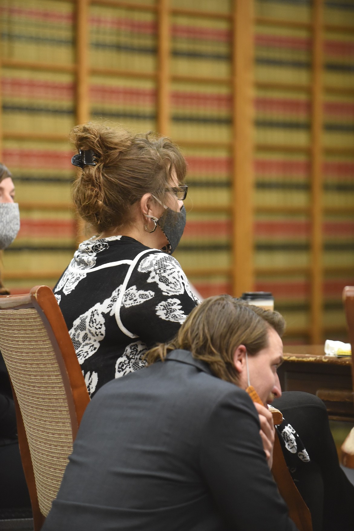 Danielle Jeanette Wood sits at a table while her attorney, Greg Rapkoch, talks with co-counsel Keenan Gallagher in the Sanders County Courtroom last week in Thompson Falls. Wood is on trial, accused of murdering her ex-boyfriend, Matt LaFriniere. (Scott Shindledecker/Daily Inter Lake)