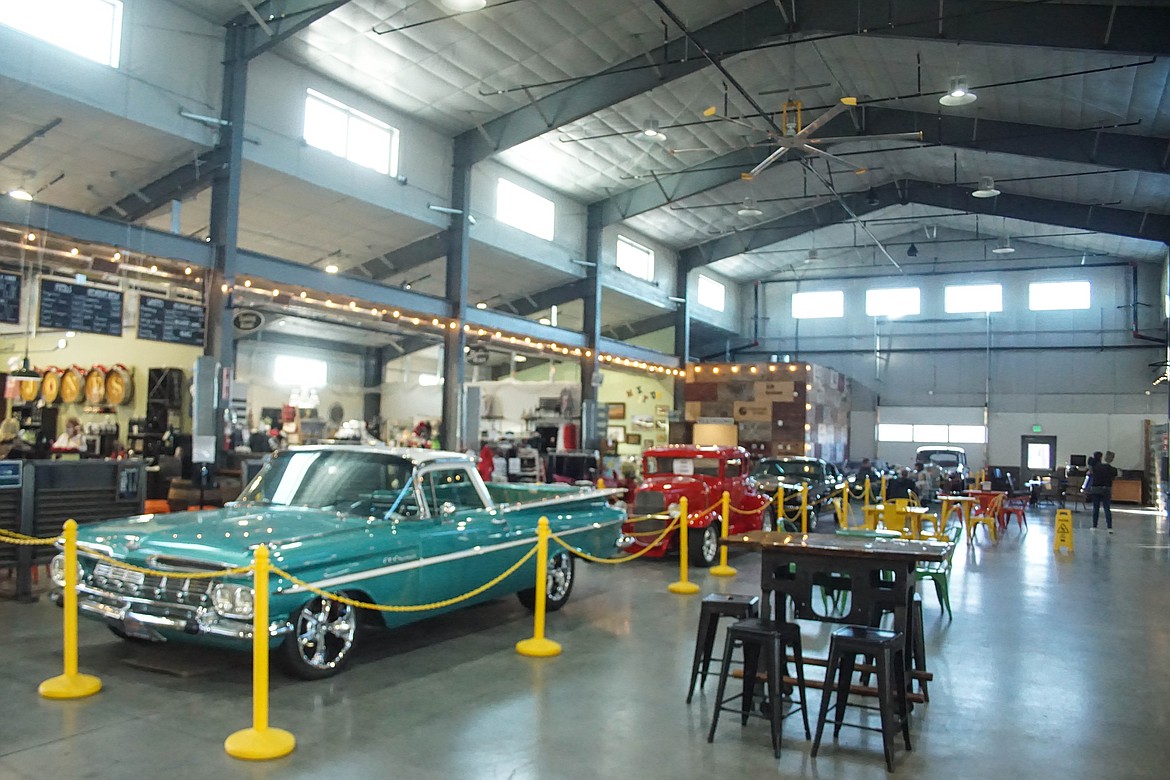 An original 1959 El Camino leading a line of cars in the QUincy Public Market.