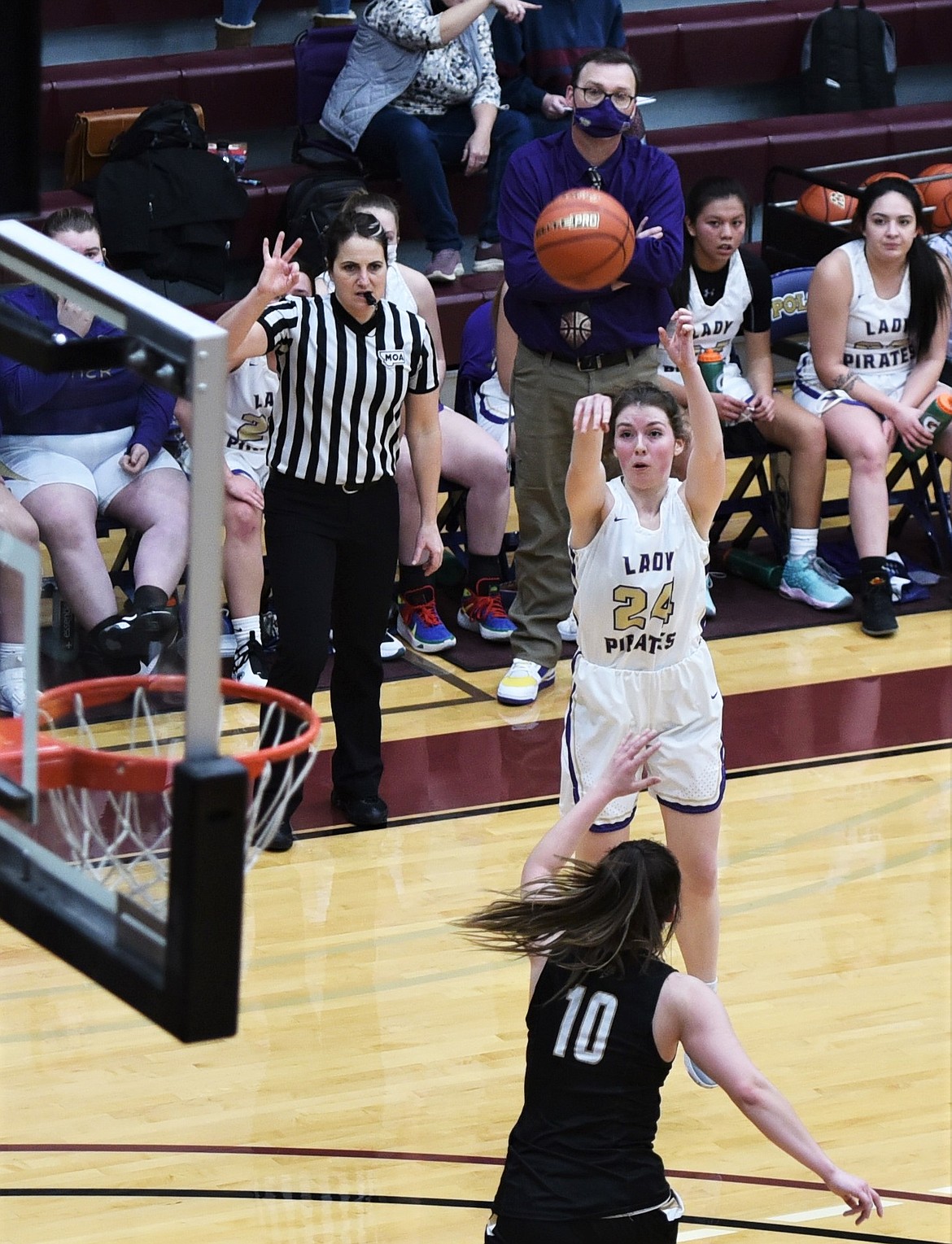 Polson's Megan Rost shoots a 3-pointer over Maliya LeCoure of Stevensville. (Scot Heisel/Lake County Leader)