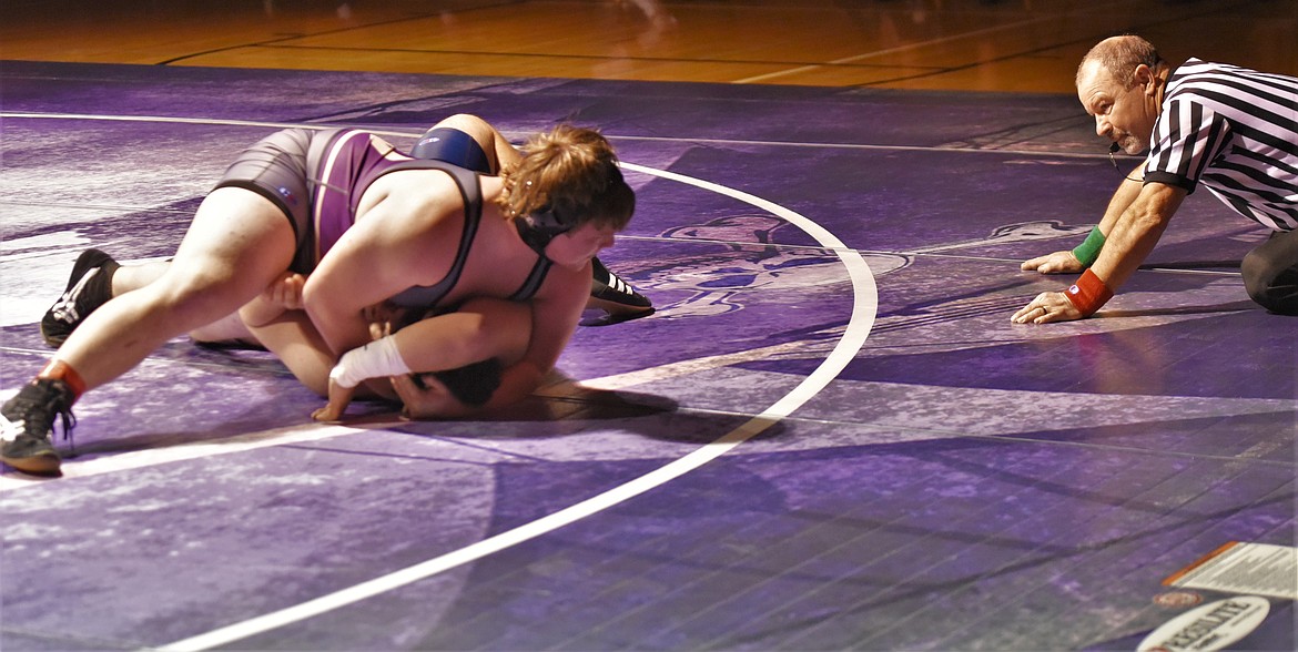 Aaron O'Roake of Polson looks to the ref as he pins Dillon's Mateo Martinez in their varsity 285-pound match. (Scot Heisel/Lake County Leader)