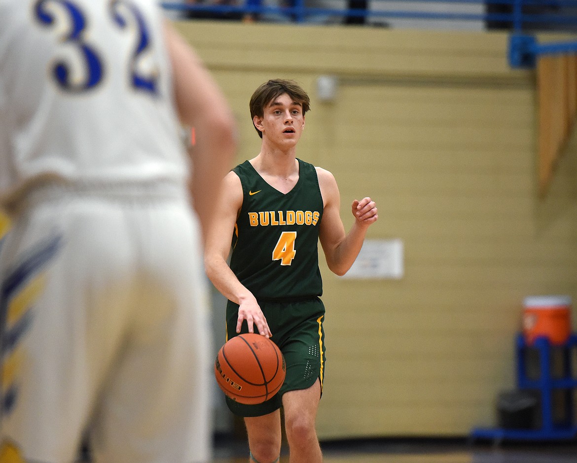 Bulldog Bodie Smith dribbles the ball down the court against the Loggers in Libby on Friday. (William Langhorne/The Western News)