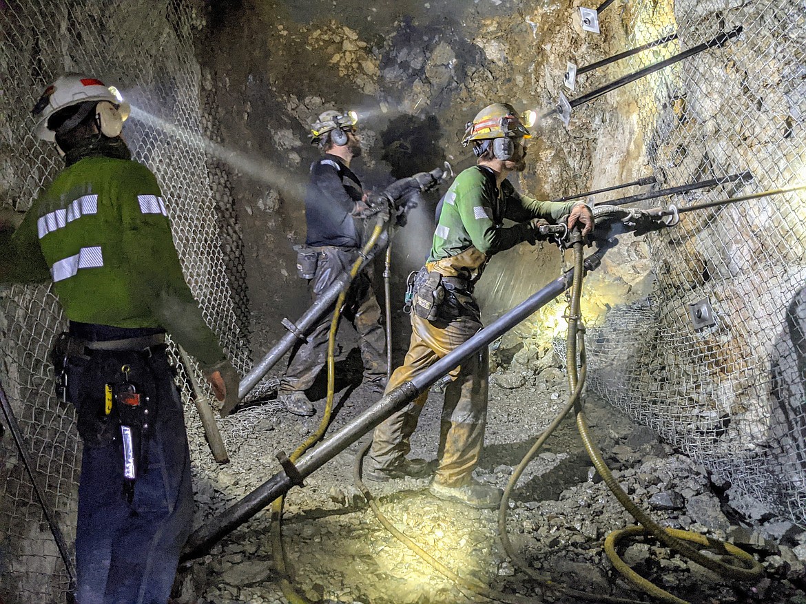 Mine Superintendent Chris Neville supervises Brent Lister and Will Curl as they bolt in the 6350 — 12 stope.