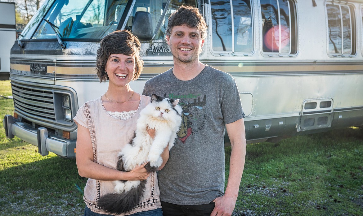 Brittain Kovac, Josh Shukman and their cat, Walter, outside "Maxwell", a 1987 Airstream Motorcoach. Courtesy Barry Benton, The Virtual Campground.