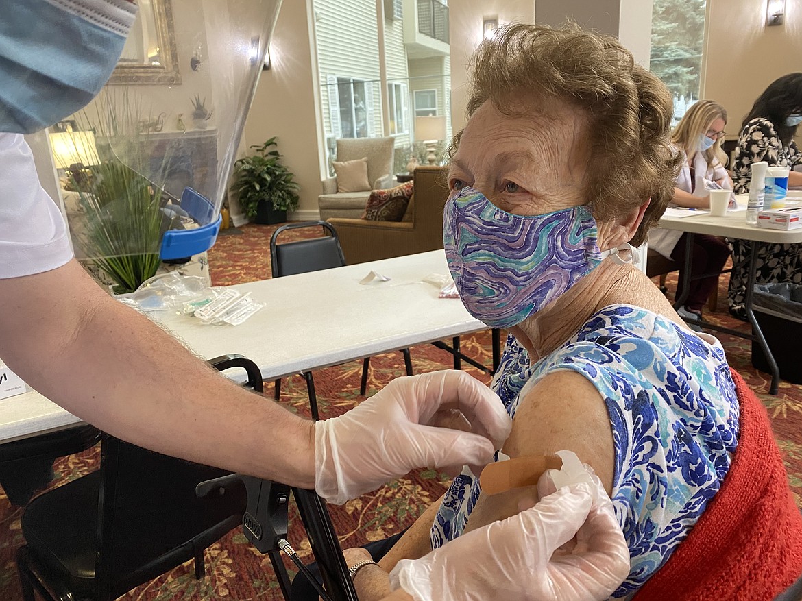 Filled with excitement, 94-year-old North Star resident Martha Sandstorm smiles under her mask after receiving her second round of the Pfizer vaccine Monday morning at North Star in Coeur d'Alene. (MADISON HARDY/Press)