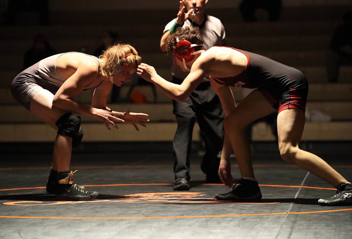 Priest River's Devin Nessel (left) takes on Moscow's Andrew Bollinger on Jan. 20 at PRLHS.