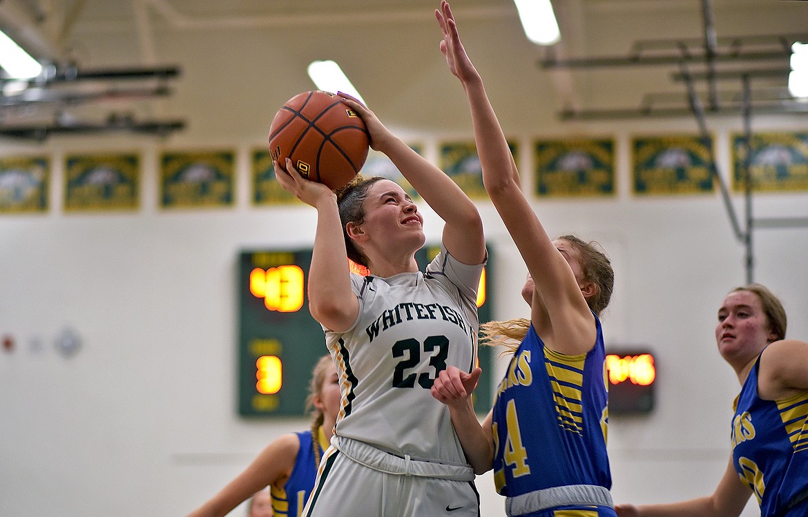 Lady Bulldog Gracie Smyley drives to the hoop in a game against Libby Friday evening. (Whitney England/Whitefish Pilot)