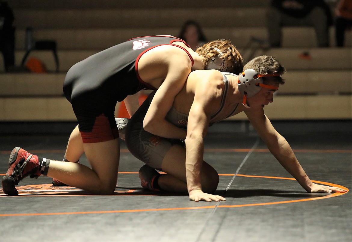 Priest River's Keegan Poirier (right) tries to escape the grasp of Moscow's Diego Deaton during a 152-pound bout on Jan. 20 at PRLHS.