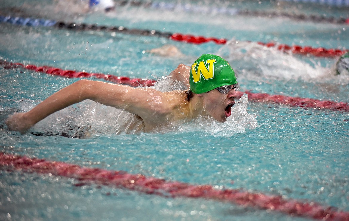 Bulldog junior Logan Botner swims to a first-place finish in the 100 Yard Butterfly race at the Cat-Dog Invite on Saturday. (Whitney England/Whitefish Pilot