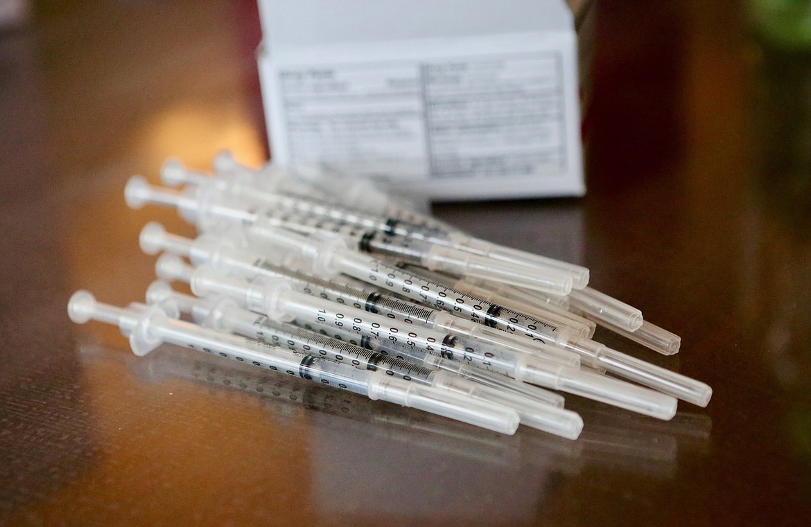 Doses of the COVID-19 vaccine are piled on a table during a vaccination clinic at Rising Mountains Assisted Living in Bigfork.
Mackenzie Reiss/Bigfork Eagle