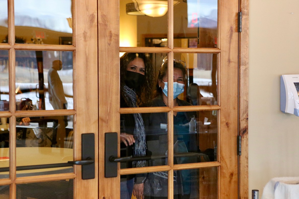 Employees of Rising Mountains Assisted Living watch through a window as their co-workers get the Pfizer-BioNTech vaccine for the coronavirus.
Mackenzie Reiss/Bigfork Eagle