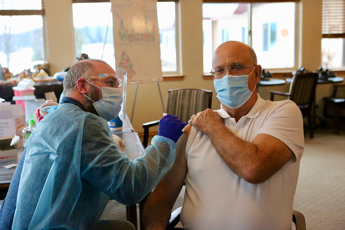 Pharmacist Vince Stone gives Barry Woods the COVID-19 vaccine on Friday, Jan. 22.
Mackenzie Reiss/Bigfork Eagle