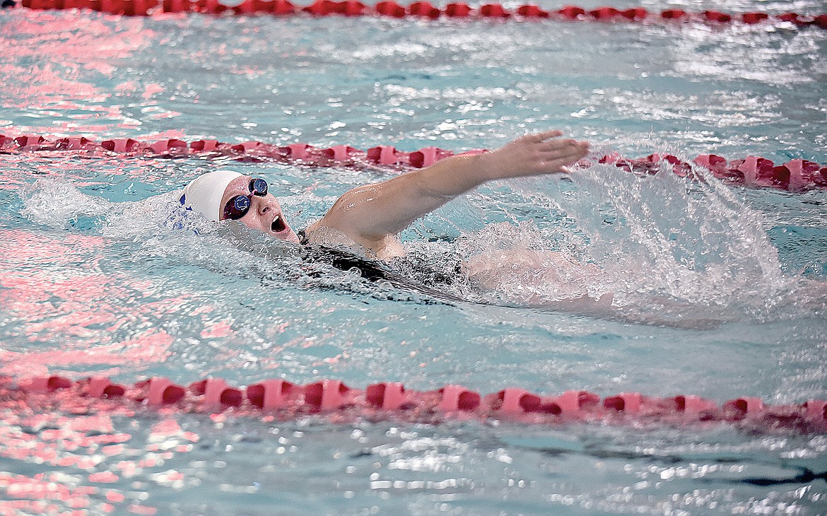 Wildkat Kaylee King swims in the Girls 400 Yard Freestyle Relay at the Dog-Cat Invite on Saturday. (Whitney England/Whitefish Pilot)