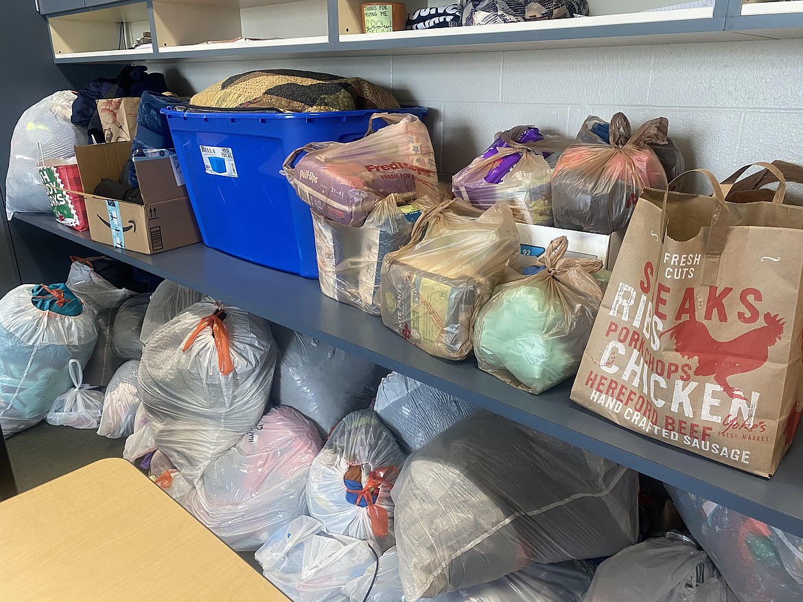 Baby items, blankets, warm clothing and feminine hygiene items are among the numerous bags and boxes of donations the Lake City High School student body collected while working with Coeur d'Alene High during the All for AWL Month of Giving.