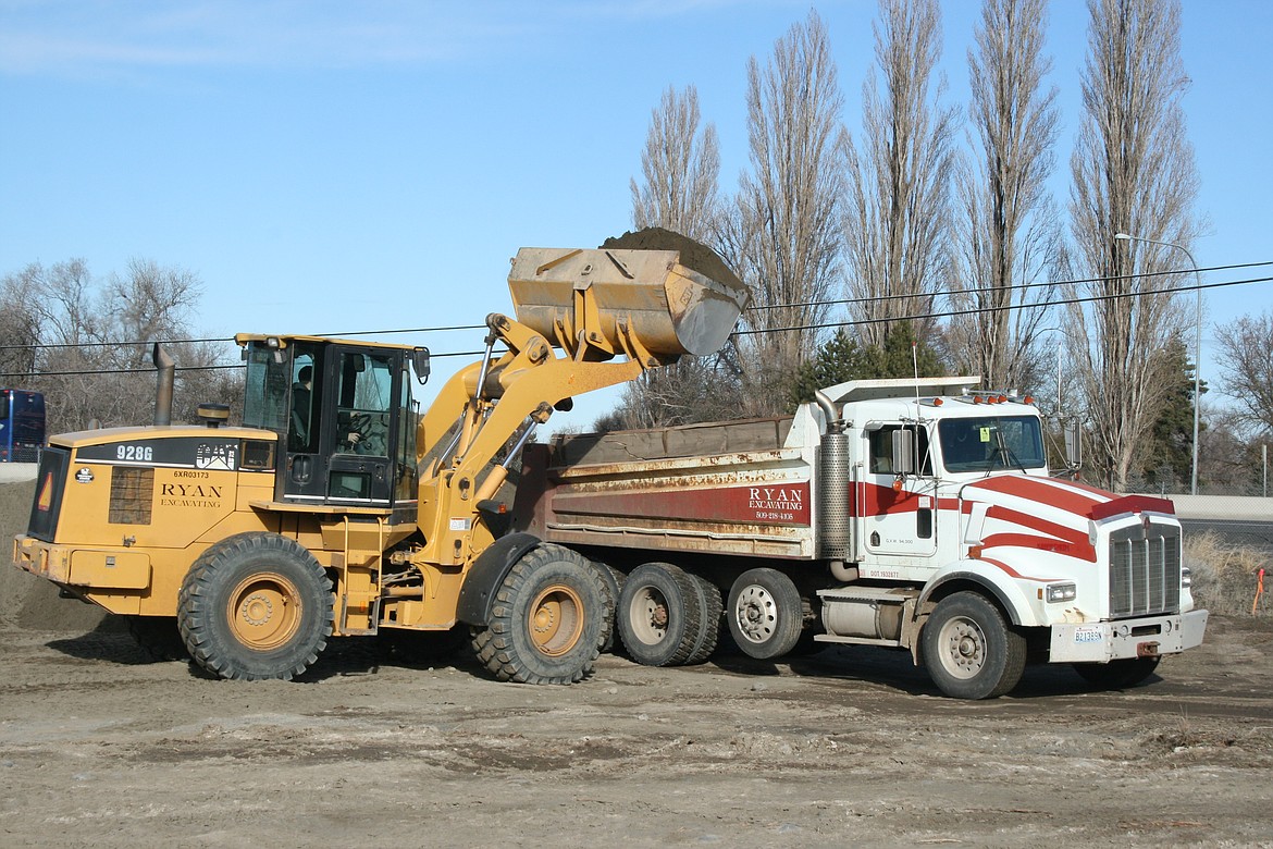 Building a wetland, at least the wetland under construction at the Love's Travel Stop location in Moses Lake, requires moving a lot of dirt. The work is being done by Ryan Excavation, Spokane.