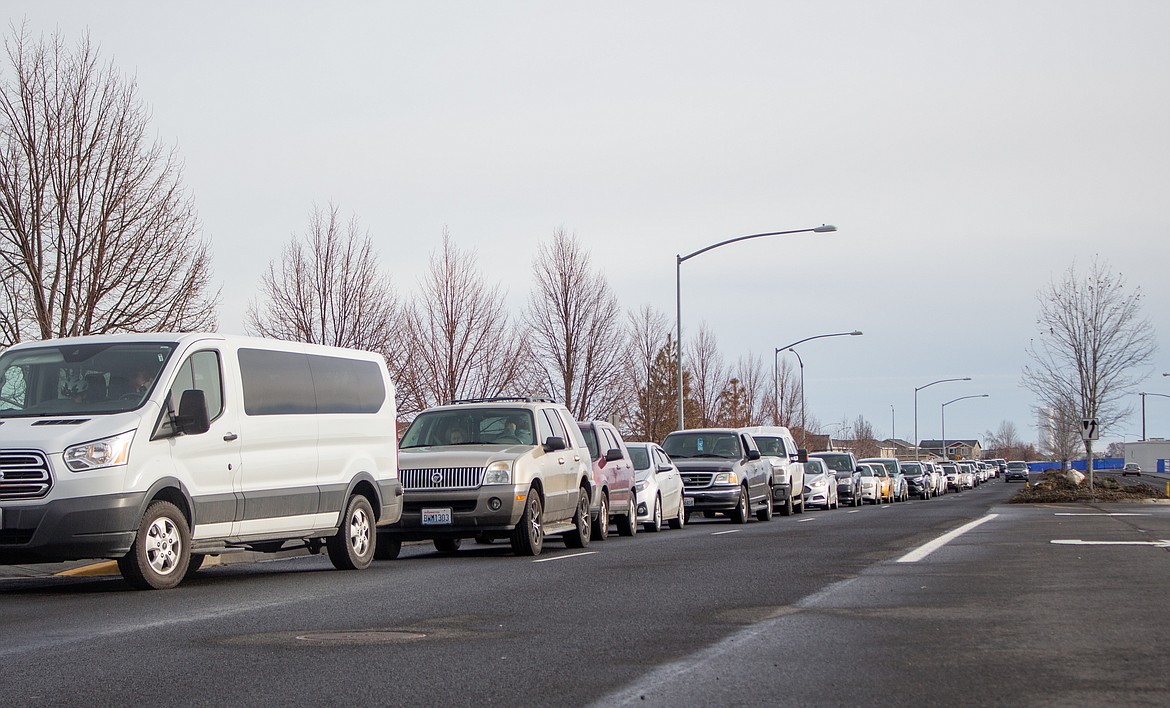 Cars lined up a long ways down Yonezawa Boulevard in front of Moses Lake Christian Church before the food box giveaway even began on Thursday afternoon.