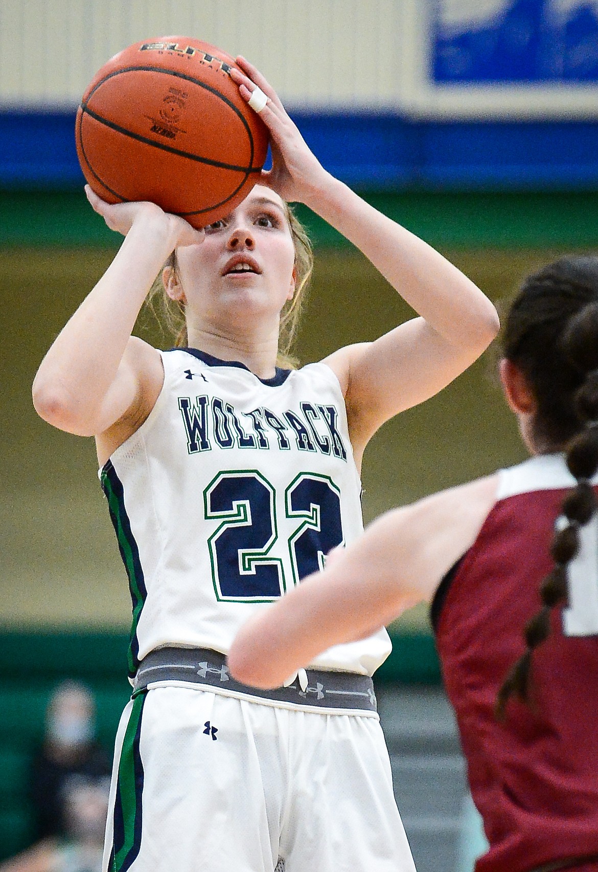 Glacier's Ellie Keller (22) pulls up to shoot in front of Helena's Reegan Walsh (10) at Glacier High School on Thursday. (Casey Kreider/Daily Inter Lake)