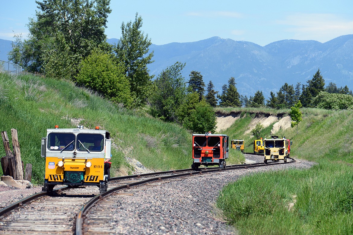 Passengers in rail cars tour a stretch of train tracks that will be removed for the future Kalispell Parkline Trail on Thursday, June 7, 2018. (Casey Kreider/Daily Inter Lake)