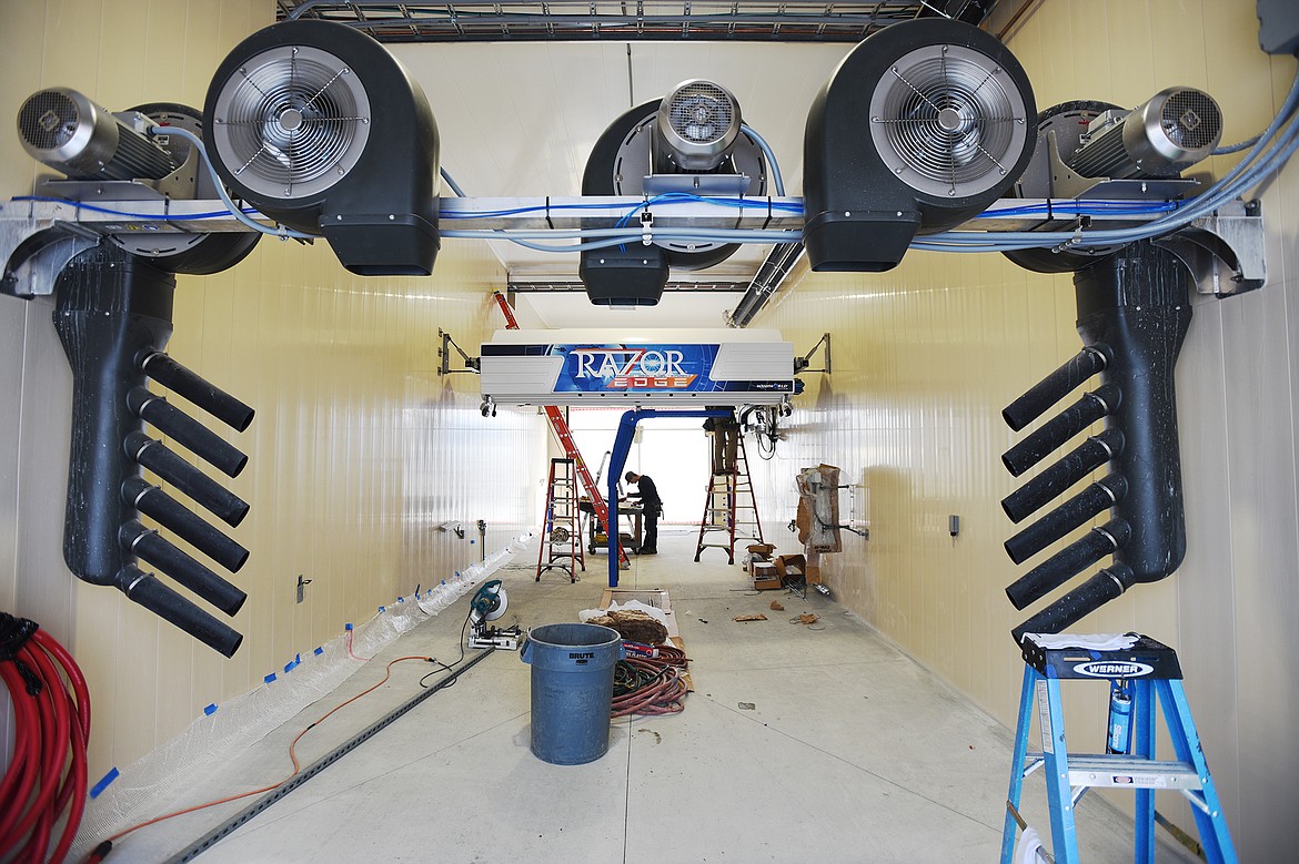 Work continues inside one of the bays at Whitefish Superwash in Whitefish on Thursday. (Casey Kreider/Daily Inter Lake)