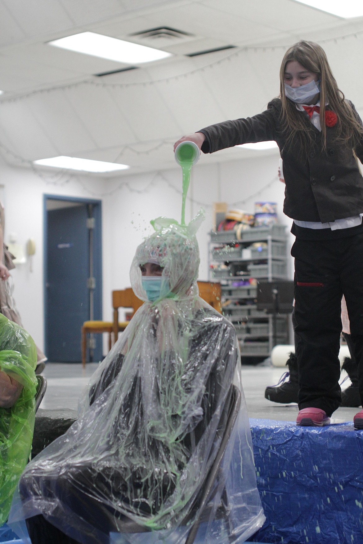 A young girl "slimes" Principal Susie Luckey Thursday afternoon at Idaho Hill Elementary.