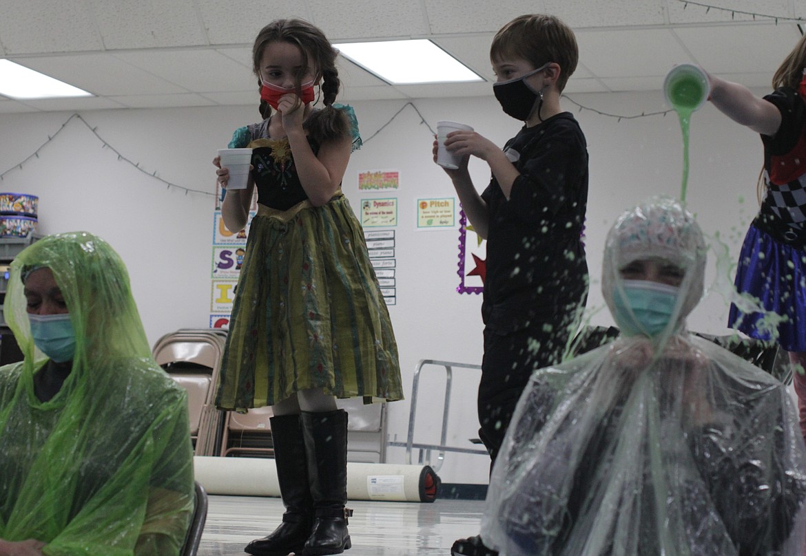 A student pauses to decide who she's going to throw slime on Thursday afternoon at Idaho Hill Elementary in Oldtown.