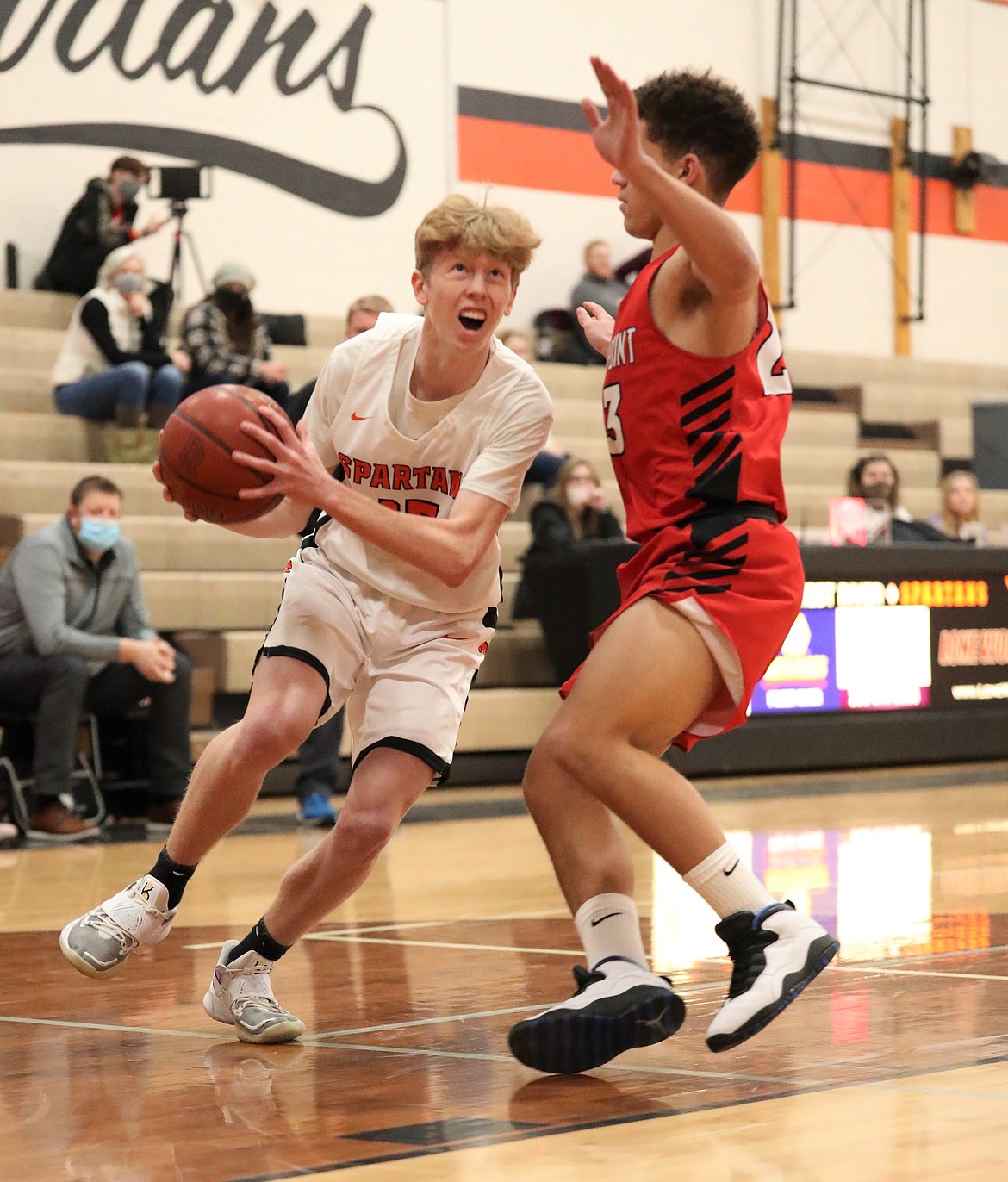 Junior Blake Barrett attacks the paint during a home game against Sandpoint on Jan. 19. Barrett tallied 19 points and 11 rebounds in Thursday's win over North Idaho Christian.