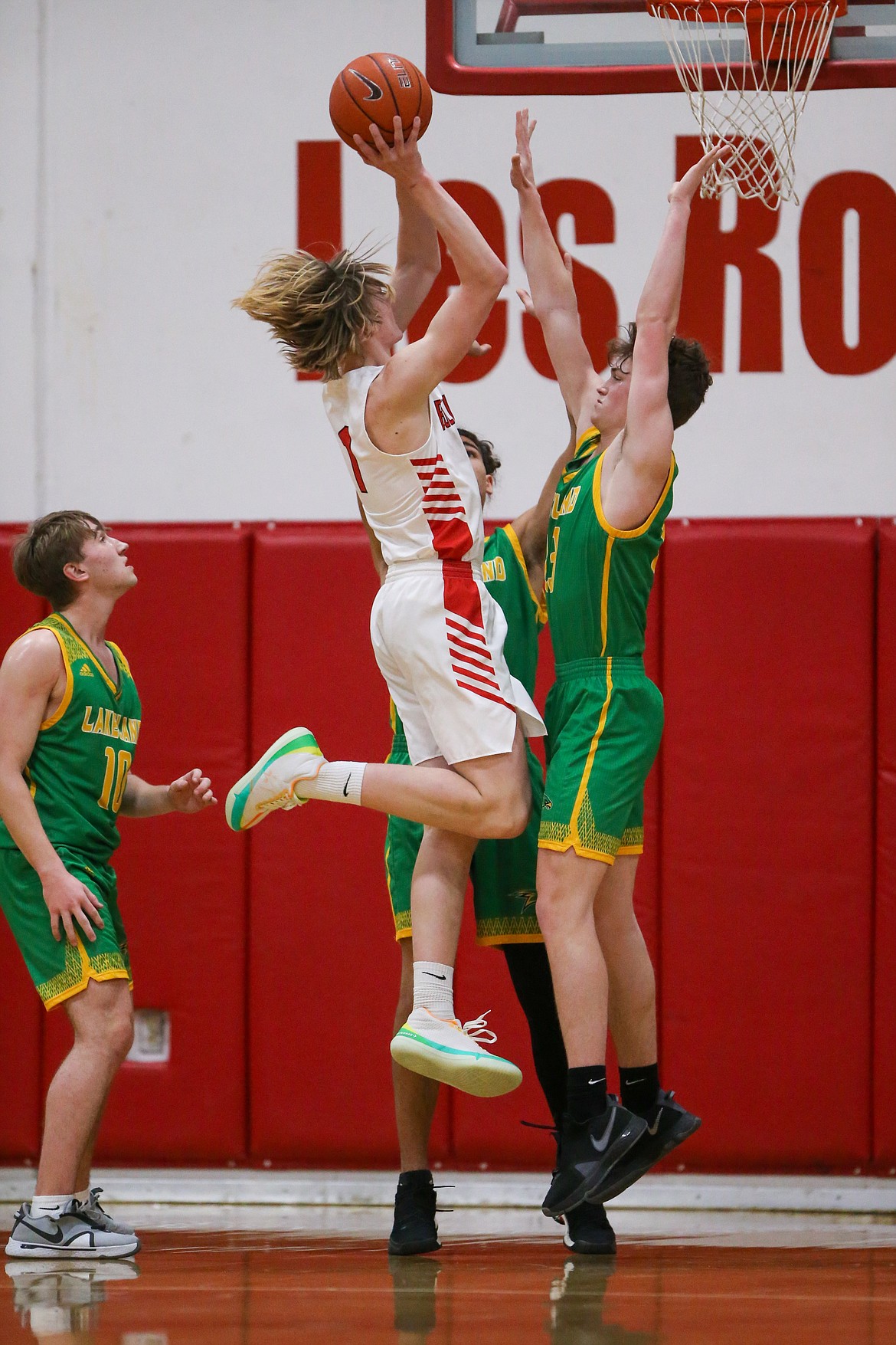 Colin Roos elevates for a layup during the first half of Thursday's game against Lakeland.