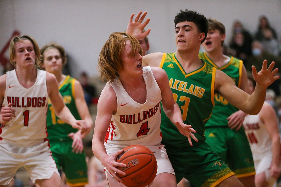 Rusty Lee fights through contact in the paint on Thursday.