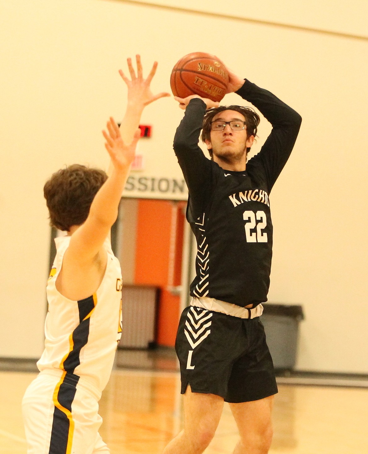 JASON ELLIOTT/Press
Lakeside small forward Jayson 'JJ' Hall shoots a jumper over Genesis Prep junior guard Caleb Schroeder during the first half of Friday's game at The Courts at Real Life in Post Falls.